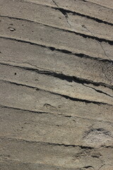 unfinished concrete dries as it falls on the ground