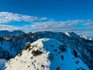 Jagged peaks of Julian Alps with snow-covered slopes in Kranjska Gora. Seen from Karawanks mountain...