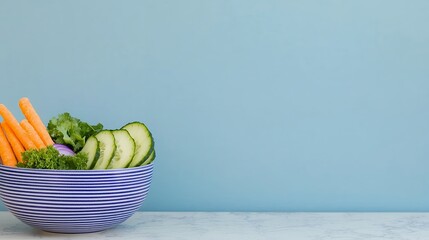 Fresh Vegetable Bowl Carrots, Cucumber, and Kale on Blue Background