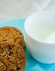 Oats Cookies With Glass Of Milk. Biscuits with milk close-up.