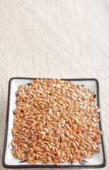 Close up photo of flax seeds, selective focus.