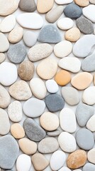 Collection of smooth, multi-colored pebbles arranged closely, showcasing various natural textures and shades, ideal for backgrounds or design elements.