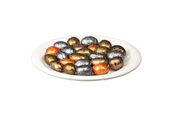 Multi color dragee in white plate isolated on a white background. Close up shot. Ramadan candy concept idea