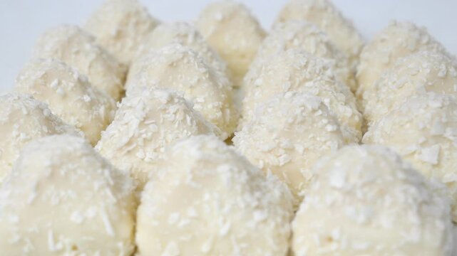 Candy wrapped in coconut chips. A delicious dessert of crispy waffles, sweet, delicate cream sprinkled with coconut chips