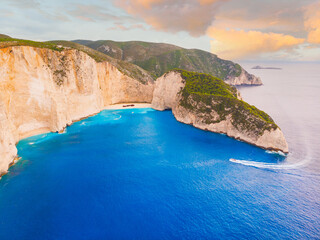Navagio bay with shipwreck popular tourist attraction in beautiful turquoise Ionian sea on Zakynthos island, drone aerial view