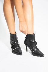 woman legs in black shoes