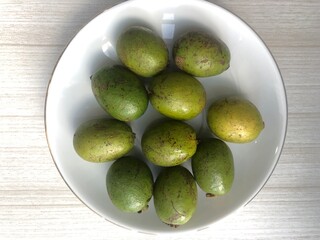 A plate of matoa, sweet and juicy original fruits from Papua, Indonesia.