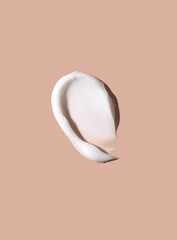 Cosmetic smear of cream texture on beige background. Skin care.