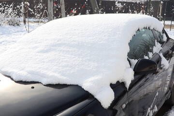 A SnowCovered Car Roof Set Against a Stunning Winter Landscape for an Enjoyable Scene