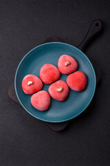 Delicious sweet mochi in the shape of red hearts