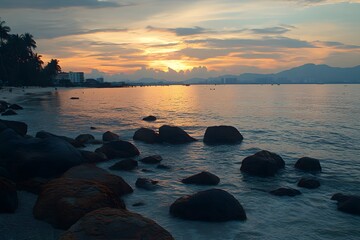 Tropical beach sunset rockscape, city skyline