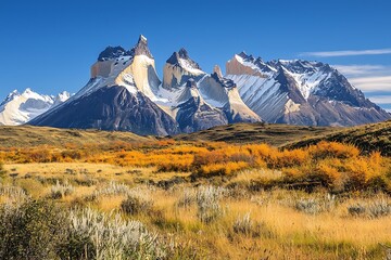 Stunning mountain landscape with peaks reaching toward a clear blue sky, ideal for outdoor adventures