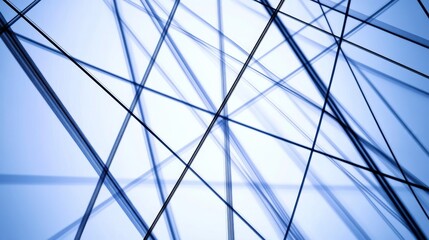 Abstract blue lines intersecting against a light background, creating a modern artistic composition