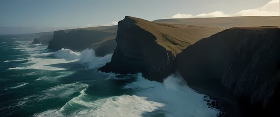 An impressive scenic view of rugged coastlines down below where waves crash against cliffs creating a powerful dance of nature