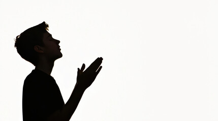 easter sunrise service. Silhouette of person praying with hands lifted in devotion