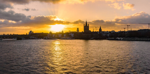 Panorama of the sunset over the historic town and Rhine river in Cologne, Germany