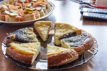 Snacks on the table. Canapes, cake, coffee on the table in the room