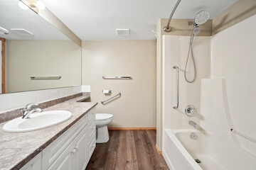 Bathroom with a white toilet, sink, and bathtub