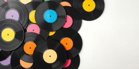 Colorful vinyl records background. Music themed designs, retro party promotions, or nostalgic audio equipment advertisements.