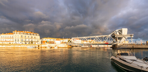 Bridge of the Tivoli and boats on the Peyrade canal, from the orient quay in Ste, Occitanie, France