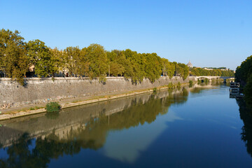 View on Tiber river from Ponte Vittoria Emanuele II with the dome of Tomba di Francesco Borromini visible in the background
