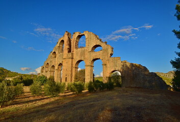 Ancient Aspendos aqueduct at sunset. Turkey