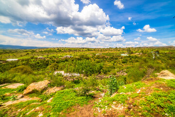 Rural landscape of the low deciduous forest, mountains with vegetation and blue sky with clouds, at the Los Cardos ranch in Monte Escobedo, Zacatecas