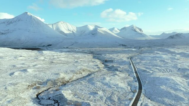 Road heading towards the peaks of Sgurr Mhairi, Beinn Deard Mhor, the Red and Black Cuillins, Isle of Skye, Highlands, Scotland, United Kingdom