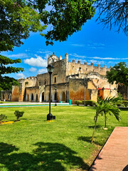 Fototapeta premium Convent of San Bernardino de Siena - Side view of the entrance of the historic convent built in 1560 in the Sisal indigenous area of historic Valladolid town,a Pueblo Magico city in Yucatan,Mexico