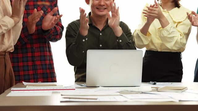 Architect and safety engineer celebrate success design building blueprint project on laptop with architectural document and measurement tool scatter around at modern office. Closeup. Delineation.