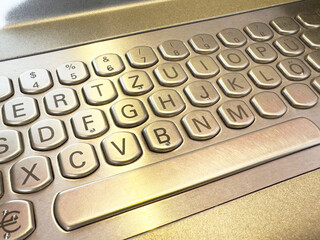 Metallic german keyboard with hexagonal keys in close-up view