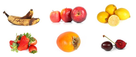 Variation of various fruits on a white background: apples, strawberries, banana, persimmon, lemons, and cherries