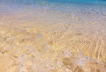 waves on the beach and golden sand