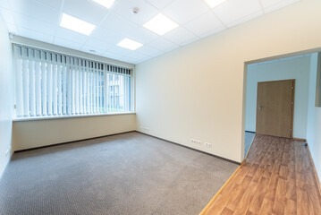Well-Lit Empty Office Room With Large Windows and Clean Design Interior. Bright and empty office with large windows clean design, offering a professional workspace fully illuminated by natural light