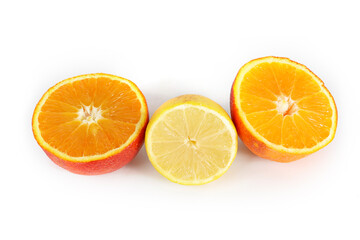 Orange and lemon cut in half on a white background