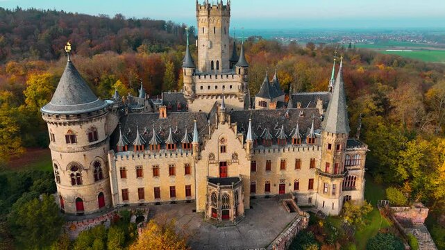 Aerial drone view of medieval castle Marienburg in forest on hill near Hanover in Lower Saxony, Germany. High quality 4k footage
