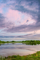 Fototapeta premium Lake with a cloudy sky in the background