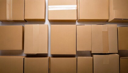 Brown cardboard boxes arranged neatly on a white surface for shipping and storage purposes