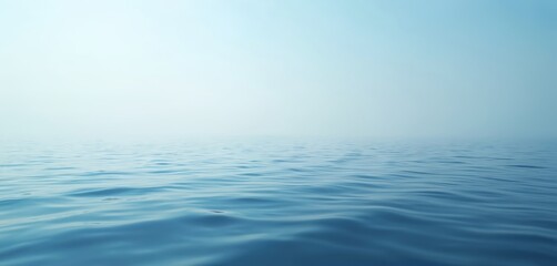 Serene calm water surface. Blue tranquil water background. Peaceful lake sea view. Natural beauty. Light blue subtle waves on water. Peaceful, calm atmosphere. Clear liquid water. Relaxing peaceful
