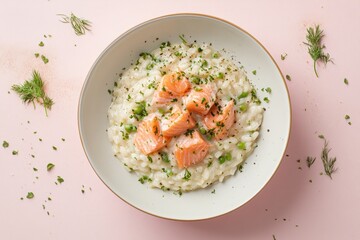 Creamy salmon risotto adorned with fresh herbs and peas