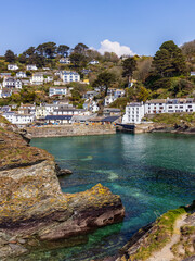 The narrow entrance to the inner harbour of Polperro.  Polperro is a charming and picturesque...