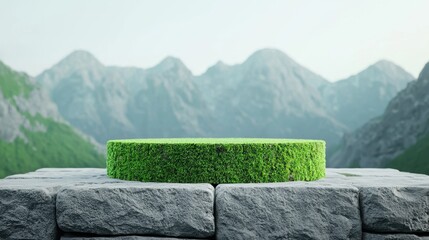 A circular green platform made of grass is set against a backdrop of majestic mountains, creating a serene and natural landscape.