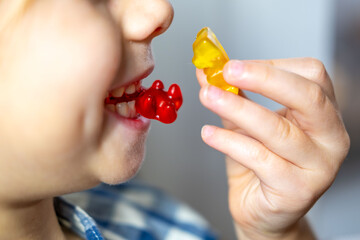 small child, girl 5 years old wants eat gelatinous sweets, gummy bear, happy childhood, sweet life,...