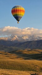 Fototapeta premium Hot Air Balloon Over Mountain Range