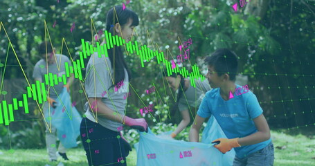 Volunteers collecting trash in park with financial data processing image over them