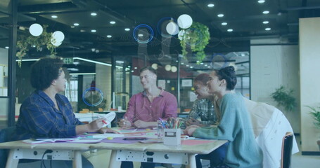 Image of scope and data processing over diverse business people in office