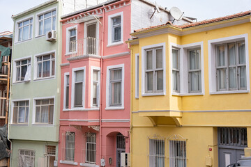 Colorful historic houses with ornate windows in Balat, Istanbul. Touristic district, attractions with historical sites. Colorful streets in Balat. Local and foreign tourists love this place