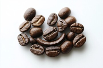 Fototapeta premium Collection of dark roasted coffee beans on a white surface