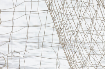 Soccer net against snow in winter