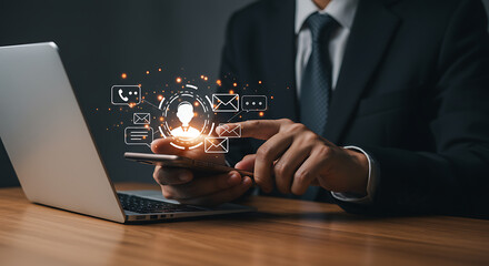 Businessman Using Smartphone With Digital Interface On Wooden Desk